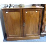 A Victorian mahogany two door Cupboard by Robson & Sons, Newcastle on Tyne, the doors opening to