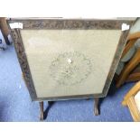An Edwardian mahogany Fire Screen/Tilt-top Table, an embroidered inset with floral decoration