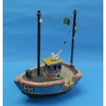 Shirley Foote; a sculpted model of a Fishing Boat, depicting a small colourful boat with a seagull