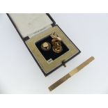 A 9ct yellow gold Tie Pin, with engine turned decoration and vacant cartouche, 2¾in (7cm) long,