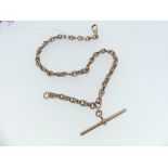 A 9ct rose gold Watch Chain, formed of open oval and ropework links, with suspension clip and T-Bar,
