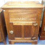 An American 20thC oak Ice Box, with hinged top enclosing lead lined ice basin, above a door and