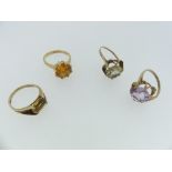 Four 9ct yellow gold Dress Rings, one set with a pale mauve stone, the others with orange/yellow