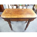A William IV mahogany folding Tea-Table, with swivel action and rosewood banding, on turned and