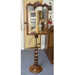 A Victorian carved mahogany telescopic adjustable Mirror, the shaped rectangular plate in carved