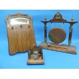 A Victorian oak and brass Dinner Gong, with matching beater, with a central brass head of a woman