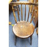 A pair of 20thC pine Kitchen Chairs, the stick back, upon the somewhat inverted circular seat,