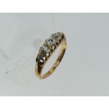 A small graduated five stone diamond Ring, the old cut stones claw set in yellow metal, marks