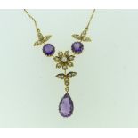 An attractive Necklet, of seed pearls and amethysts with central seed pearl flower and tear drop