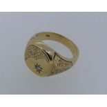 A 9ct yellow gold gentleman's Signet Ring, the squared front with foliate engraving a gypsy set with