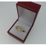 A 14ct yellow gold Half Eternity Ring, the front channel set with nine graduating diamond, total
