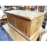 A 20thC reclaimed pine Blanket Box, flanked by planked sides and twin handles, a lid enclosing a