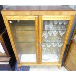 An Art Deco-style oak and satinwood Glazed Bookcase, with walnut and mahogany inlay, two glazed door