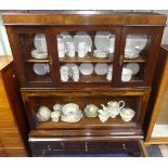 An antique walnut Glazed Cabinet, comprising one central large compartment enclosed by two glazed