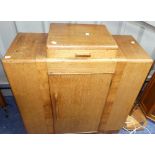 An Art Deco-style oak and mahogany Stepped Bookcase, comprising a central drawer upon a cupboard,