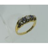 A small five stone sapphire and diamond Ring, all mounted in 18ct yellow gold, Size J.