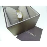 A Gucci 5500L stainless steel and gold plated lady's bracelet Wristwatch, quartz movement, the white