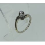 An 18ct white gold Ring, set on the cross with two small diamonds, Swedish hallmarks, Size J, approx