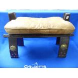 A vintage wood and leather Camel Saddle Stool, with brass mounts, 23in (58.5cm) long x 14½in (