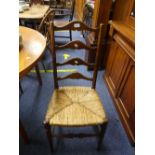 A pair of early 20th century ash and elm ladder-back Chairs, with rush seats (2)