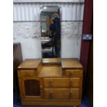 An Art Deco-style oak Bedroom Suite, comprising a Duchess Dressing Table, with a long central