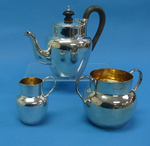 An Edwardian silver three piece 'bachelor' Tea Set, by H J Cooper & Co Ltd., hallmarked