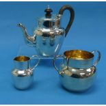 An Edwardian silver three piece 'bachelor' Tea Set, by H J Cooper & Co Ltd., hallmarked