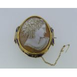 A large late 19thC French 18ct gold mounted shell Cameo, the cameo depicting Flora, the frame formed