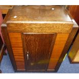 An Art Deco-style oak Stepped Cabinet/Bookcase, one central door enclosing a shelved compartment,