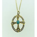 An unmarked yellow gold open oval Pendant, the central cross shape set with seed pearls and