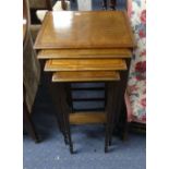An Edwardian mahogany and inlaid Nest of four Tables, all on square tapering legs and spade feet,