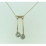 An Edwardian 15ct yellow gold Necklace , the centre with three seed pearls suspending two drops,