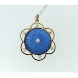 A 9ct yellow gold circular Pendant, the centre with pale blue guilloche enamel, with an open loop