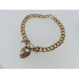 A 9ct yellow gold curb link Bracelet, with a 9ct rose gold padlock clasp, approx total weight 7.2g.