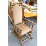 An early 20thC American oak Rocking Chair, upholstered in pink velour velvet, 21½in wide x 43½in