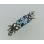 A stylish aquamarine and diamond Brooch, the central step cut aquamarine of approx 12cts, 18mm x