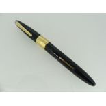 A vintage Shaeffer 'White Dot' black Fountain Pen, the gold clip, cap band and LifeTime nib all