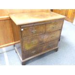 An early 20thC Georgian-style walnut Chest of Drawers, with a quarter-veneered top flanked by