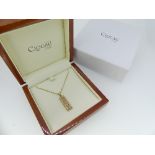 Clogau Gold; A 9ct yellow gold and diamond Pendant, of rectangular form with rose gold centre, set