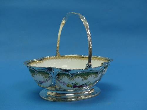 An Edwardian silver mounted Royal Worcester quatrefoil Dish, the pierced silver frame with swing