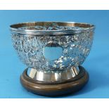 An Oriental circular silver bowl, pierced with birds amongst prunus, vacant cartouche, character