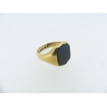 An 18ct yellow gold Signet Ring, the flared front set with a plain shield shaped bloodstone, Size