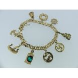 A 14ct yellow gold Charm Bracelet, the double circular link bracelet suspended with eight 9ct gold