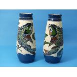 A pair of Baron Barnstaple pottery Vases decorated with stylised fish leaping from a pond with water