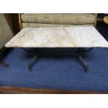 A marble topped rectangular coffee table and two tile topped square lamp tables, all with wrought