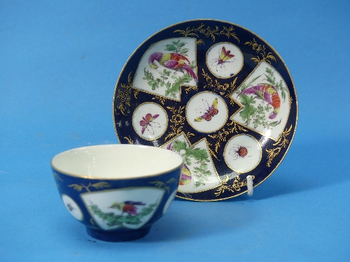 A Worcester first period Tea Bowl and Saucer, c. 1770, with blue ground and fan shaped panels set