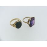 A 9ct yellow gold Signet Ring, with foliate pierced shoulders, set with an oval bloodstone, Size