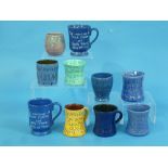 Ten various North Devon pottery Royal commemorative Mugs, Baron and Brannam, some unsigned, 1911