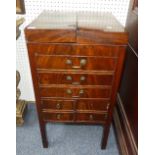 An early 19thC mahogany Gentleman's Dressing Stand, with folding top opening each side to reveal