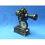 An early 20thC French 'Baby Projector', in original box, together with a quantity of baby film